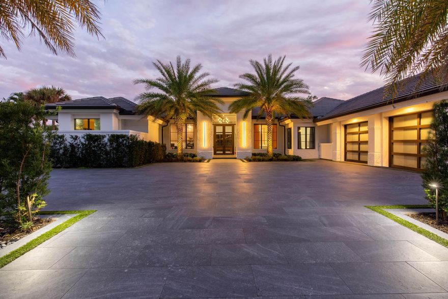 Luxury oasis in prestigious Breakers West Golf & Country Club, fully renovated in 2025 and perfectly positioned on a prime golf course lot with southern exposure. This custom estate offers 4 en-suite bedrooms, a private office, and two half baths including a cabana bath. The primary suite features dual oversized custom walk-in closets and automated blinds. Designed for refined entertaining with a wet bar, wine display, whole-home sound system, and Lutron lighting. Outdoor living shines with a covered kitchen featuring Sub-Zero and Wolf appliances, resort-style pool with sun shelves and spa, over 5,000 SF of synthetic turf, and lush clusia hedge for ultimate privacy. Oversized 3-car garage. Optional club membership available.