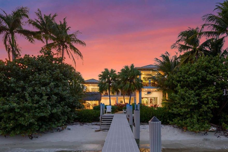 We are proud to present this rare, one acre luxury waterfront Villa to you. Tucked into a very quiet end of a Cul-de-Sac, this beautiful home offers a maximum of privacy featuring a private beach, a 280 ft private boat dock and endless water views of the lagoon. Take your boat out to the ocean in less than two minutes or enjoy the serenity of your spacious backyard. Invite your friends over for a fun night in the games room, have a barbecue cook-out by the pool, or enjoy the views with an ice-cold ''lemon drop'' from the sun deck or bar. This home was completely rebuilt in 2007 and designed to embrace the Florida waterfront lifestyle. Bitcoin & Seller Financing available. FLL and PBI airports are only 20min away,