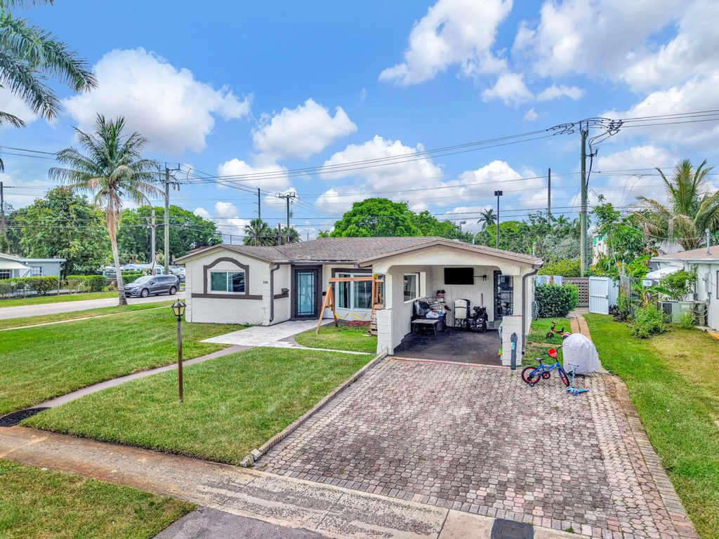 Photo of 3300 NW 32nd Street, Lauderdale Lakes, FL 33309 (MLS # B26041508)