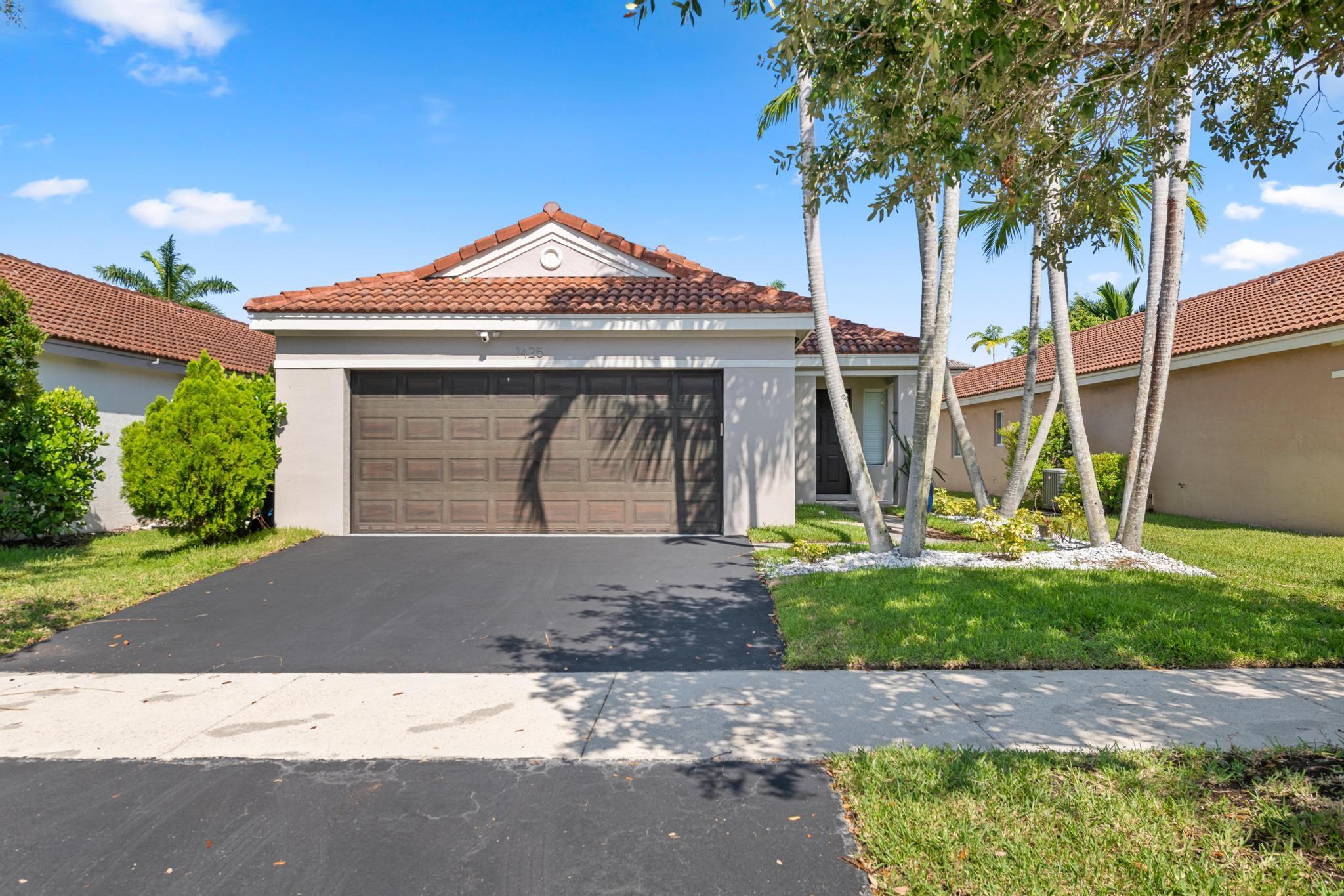 Welcome to this beautifully updated 3BR/2BA one-story home in Weston's sought-after gated community of Savanna. This bright and open home features a brand-new kitchen with granite countertops imported from Brazil, stainless steel appliances, modern flooring, and plenty of natural light throughout. Smart home upgrades include a Lutron lighting system, Nest thermostat, and a pre-installed FPL EV charger ready for your electric vehicle. Enjoy access to resort-style amenities: a clubhouse, pool with waterslide, kids’ splash zone, mini golf, and more. Zoned for Weston's top-rated A+ schools. No HOA approval required. This move-in-ready home offers the perfect blend of comfort, style, and convenience. Don’t miss your chance to live the Savanna lifestyle. Schedule a private tour today