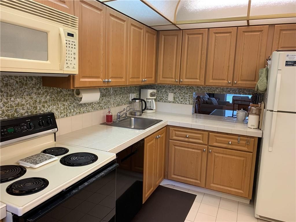 Photo of 2901 NW 46th Ave #210, Lauderdale Lakes, FL 33313 (MLS # F10309708)