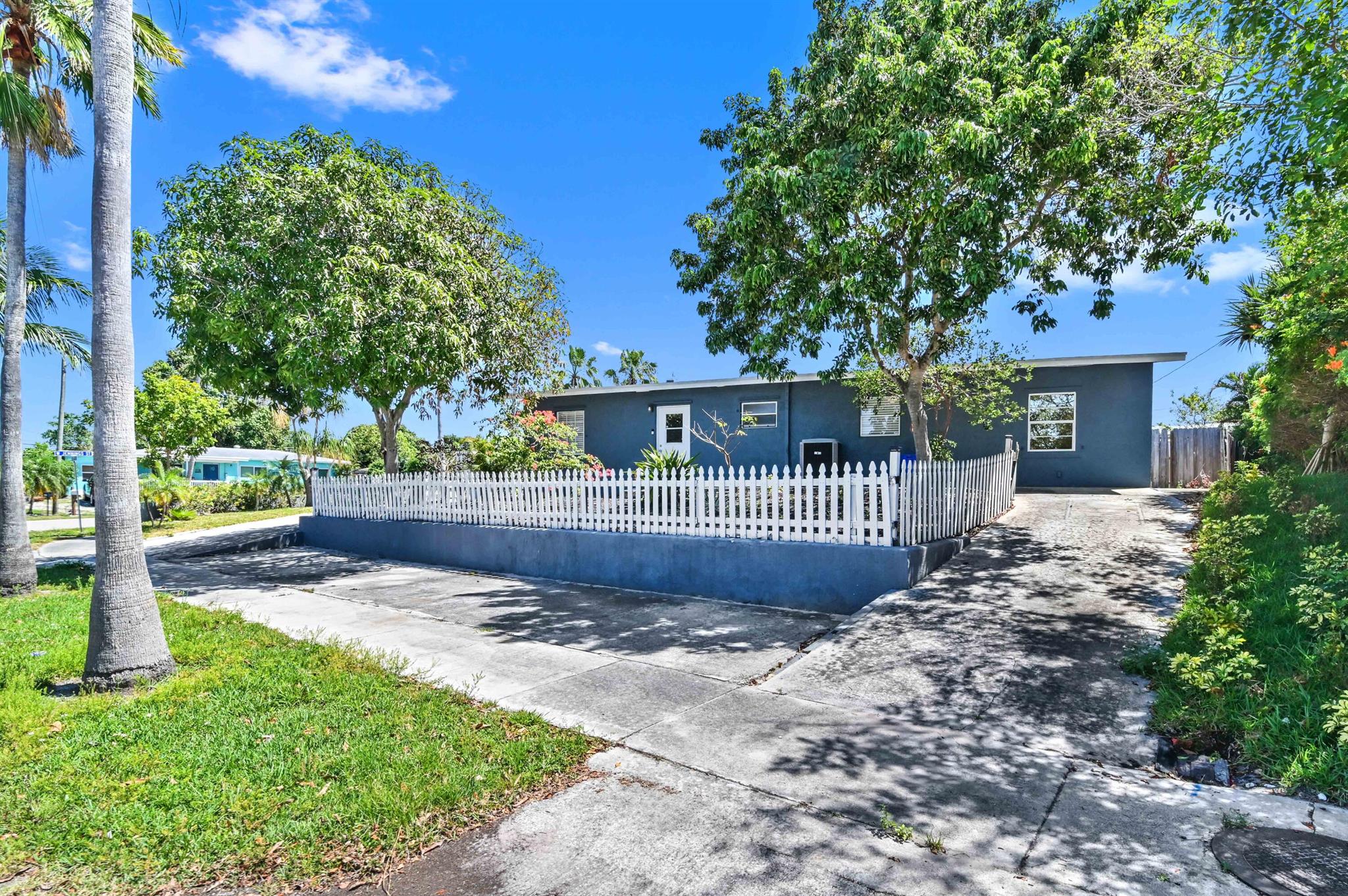 Tremendous opportunity to rent this FULLY FURNISHED pool home in Lantana, less than 2 miles from the beach! This updated corner-lot property features 3 bedrooms, 2 full baths, a living room, family room, plus a BONUS ROOM set up as an extra bedroom. RENTAL AVAILABLE SEPTEMBER - NOVEMBER 2025.Enjoy a new roof (2022), newer AC, gas water heater, SS appliances with washer & dryer, granite counters, and wood-look laminate floors. Relax by the private pool, take advantage of the large circular driveway with extra parking, and enjoy fresh mangoes from your own tree. No HOA--bring your boat or RV!