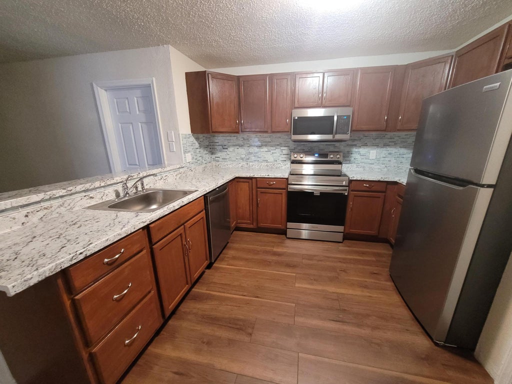 Photo of 8539 NW 23RD Manor, Coral Springs, FL 33065 (MLS # B26081700)