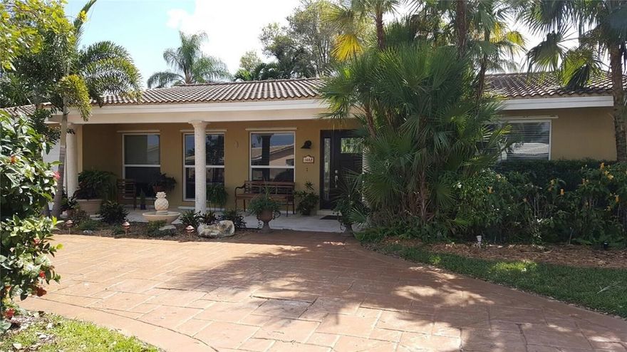 Great Location and best schools highlight this  beautiful, maintained waterfront home . Enjoy 75 feet of water frontage with ocean access and  wide canal .Florida living with large covered outdoor patio, very private lush  Jacuzzi area. Spacious open concept renovated kitchen, granite and stainless steel appliances, wood cabinets. Tile in the main house and good size bedrooms. Fireplace. Impact windows and doors for safety and security. Stamped concrete circular driveway with tropical landscaping.