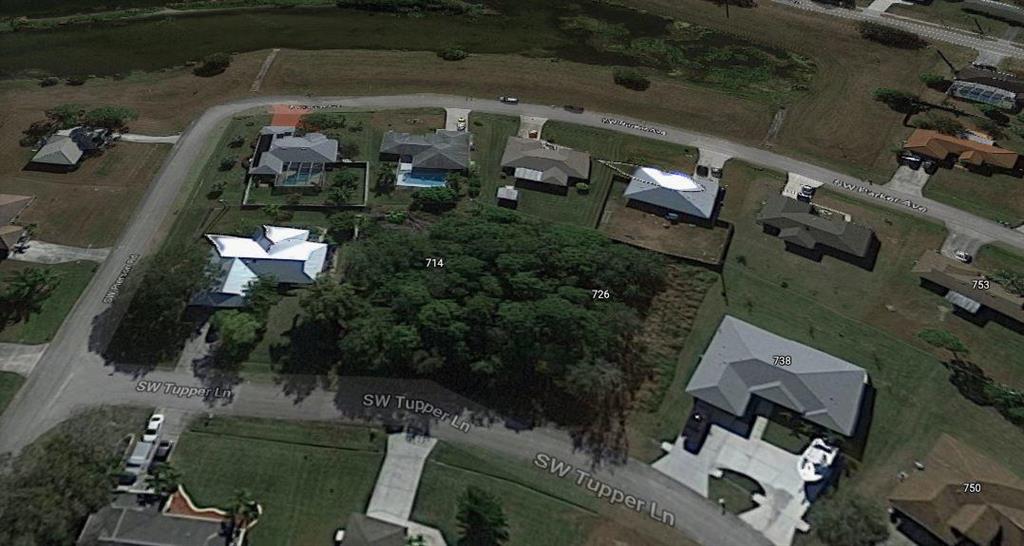 Photo of 714 SW Tupper Lane, Port Saint Lucie, FL 34953 (MLS # R10735689)