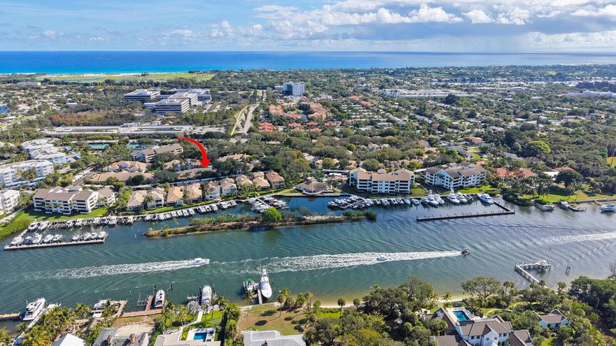 Welcome to a beautiful corner townhome in the sought-after gated community of Oak Harbour. Thoughtfully designed with two bedrooms on the main floor and a spacious loft above—perfect for additional living space or home office—this residence delivers comfort, flexibility, and timeless coastal appeal. Step inside to an inviting open living & dining area with vaulted ceilings, plantation shutters, and a charming gas fireplace. The kitchen features stainless steel appliances, granite countertops, and ample storage. A screened-in porch extends the living space outdoors, offering a peaceful spot to relax or entertain surrounded by lush, mature landscaping. Additional highlights include a 2-car garage, Tesla wall charger, water softener system & brick paver courtyard-perfect for grilling! Oak Harbour residents enjoy resort-style amenities: two pools, tennis/pickleball court, gym, clubhouse, security gate, and a private marina with boat slips available for lease or purchase. All just moments to the beach, top-rated restaurants, and convenient shopping. Experience easy, breezy coastal living in one of Juno Beach's most beloved communities.