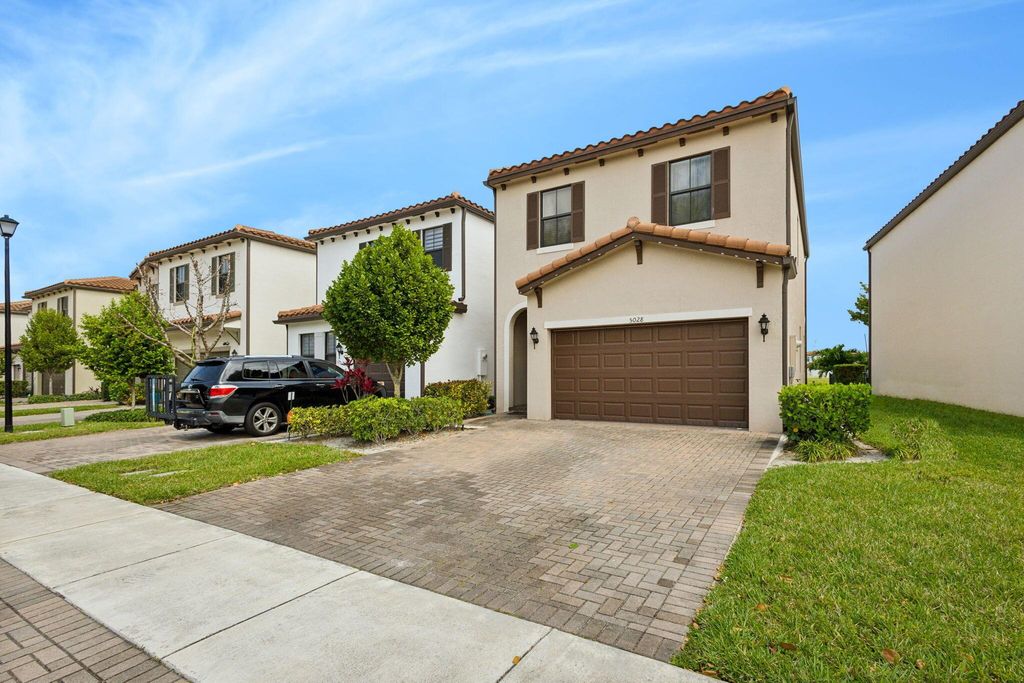 Photo of 5028 Laurel Oak Drive, Riviera Beach, FL 33410 (MLS # R10973101)