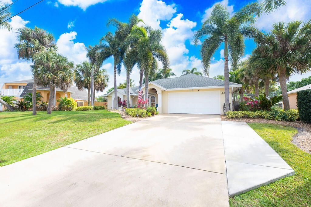 Photo of 2654 SW Acco Road, Port Saint Lucie, FL 34953 (MLS # R10966802)