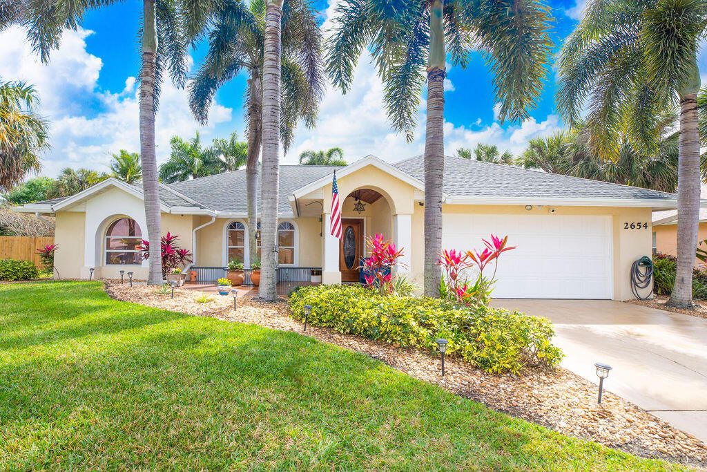 Photo of 2654 SW Acco Road, Port Saint Lucie, FL 34953 (MLS # R10966802)