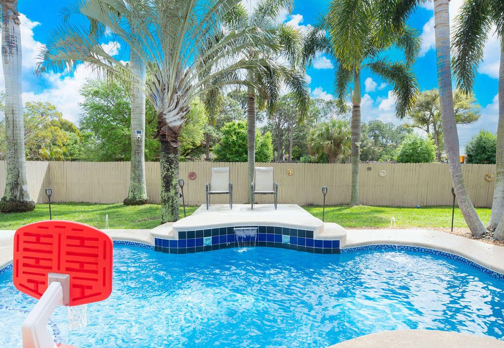 Photo of 2654 SW Acco Road, Port Saint Lucie, FL 34953 (MLS # R10966802)