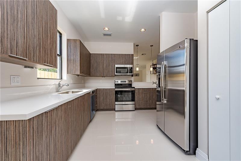 This beautifully updated 3/2.5 townhouse in Progresso is adjacent to Victoria Park, less than 5 minutes from Wilton Drive, a 5 minute Uber ride to Las Olas, downtown Ft. Lauderdale and 10 minutes to beaches! Tons of shopping, restaurants and nightlife for the urban and beach lover! Then retreat to your personal oasis and relax in your backyard soaking up the FL sunshine. Features a gourmet kitchen, tile on the 1st, updated vinyl flooring on the 2nd floor. Master has walk-in closet, dual vanity sinks, glassed in shower. Two patios, backyard is privately fenced with landscape amidst a tranquil setting. Don't miss out on this incredible slice of paradise! 24hr notice to show (Tenant occupied). Contact Priscila/office for showings.