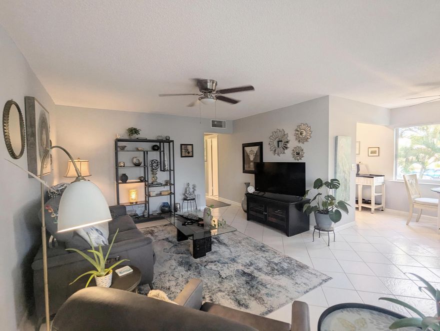 Great Location Near to Community Center! 2nd Floor, End Corner Unit with 2 Beds and 2 Full Baths, Updated Kitchen with Recessed Lighting, Double Sink and Granite Countertop. Large 2 Panel Horizontal Sliding Impact Windows allow Lots of Light and Fresh Air! Both Bathrooms have been Renovated with 1 Tub/Shower Combo and 1 Step in Shower. Crisp, White Tiled Floors in Living/Dining Areas and Kitchen. Central Air. Building is Well Maintained with New Roof, All Work Completed, Good Reserves, Beautiful Landscaping and No Assessments. 55+ Resort Style living with community amenities that include clubhouse, fitness center, pools, theater, tennis, pickleball, and courtesy transportation.