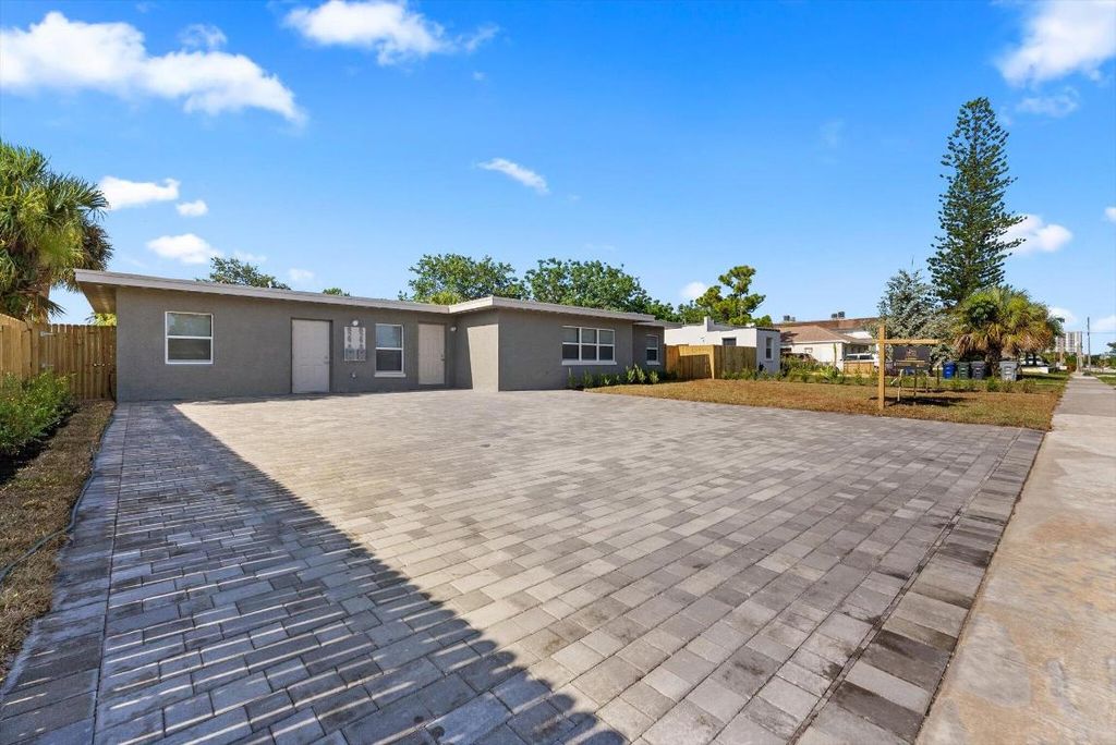 Photo of 829 Bayberry Drive, Lake Park, FL 33403 (MLS # R10998329)