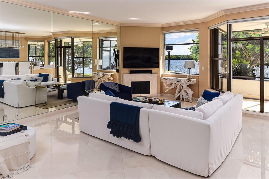 Exceptional waterfront townhouse with unobstructed views of Intracoastal and nature preserve. Beautifully renovated and offered fully furnished. 2 fireplaces, marble floors, 2 garage parking spaces, & elevator.Old Port Cove offers a deep water marina, restaurant. 24 hour security, fitness center, and walking trail. Near NPB Country Club with Jack Nicholas golf course and tennis center. New Upgrades coming soon (Fitness Center and resort style pool with expansive terrace). Please see design in documents. This is a 55 and over community. Sold furnished with exception of personal items and fishing equipment.