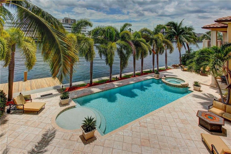 INTRACOASTAL MEDITERRANEAN ESTATE IN THE HEART OF FORT LAUDERDALE. CORAL RIDGE, 194' POINT LOT, 5BDRM/6BA/2HB BUILT IN 2004 WITH LUXURY IN MIND. FOYER GREETS YOU WITH MARBLE INLAY FLOORING AND A STUNNING CURVED MARBLE STAIRCASE,COFFERED CEILINGS,FIREPLACE,ELEVATOR,LIBRARY,FORMAL DINING,GOURMET KITCHEN VIKING GAS STOVE,SUBZERO,BUTLERS PANTRY WET BAR, WINE PANTRY, STUNNING POOL AREA,MASTER W/PRIVATE TERRACE, 400SF CLOSET,ALL BEDROOMS W/EN SUITE BATH, 3 CAR GARAGE,DOCKAGE, TOO MANY FEATURES TO LIST!