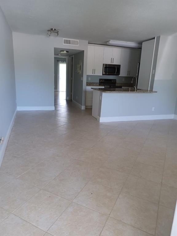 Adorable 1/1 condo in the heart of Boynton Beach at Meadows on the Green. Large open living room, dining, n area, beautiful updated kitchen, full sized washer/dryer in the unit. Master bedroom which leads to the screened balcony. This gated community features resident parking & guest parking spots, two pools, tennis, clubhouse, exercise room & play areas. Conveniently located minutes away from the Florida Turnpike, I-95, Restaurants, Shopping, Beaches