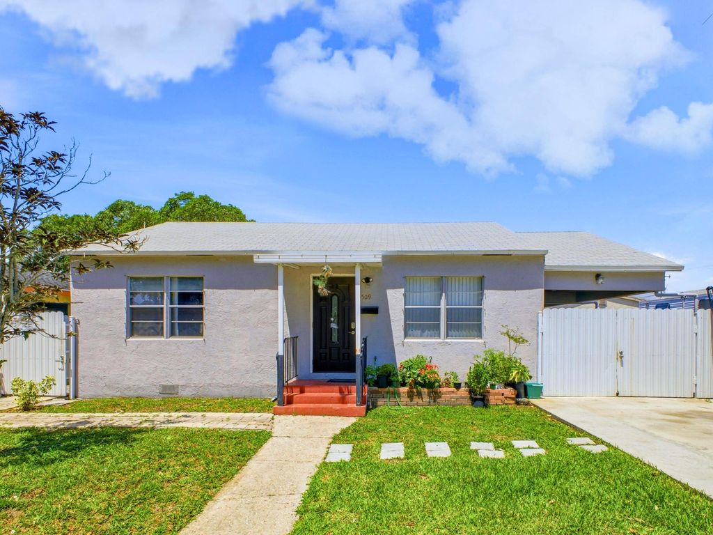 Photo of 5509 W Garden Avenue, West Palm Beach, FL 33405 (MLS # B26025187)