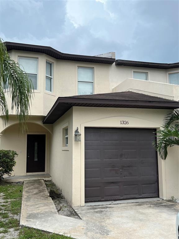 Beautiful Townhouse — 2 bedrooms plus a den (3 rooms upstairs), 2.5 baths, and a 1-car garage. Features ceramic tile in the kitchen, granite countertops, wood cabinets, and more! Both the master and second bathrooms include tubs. No HOA!
