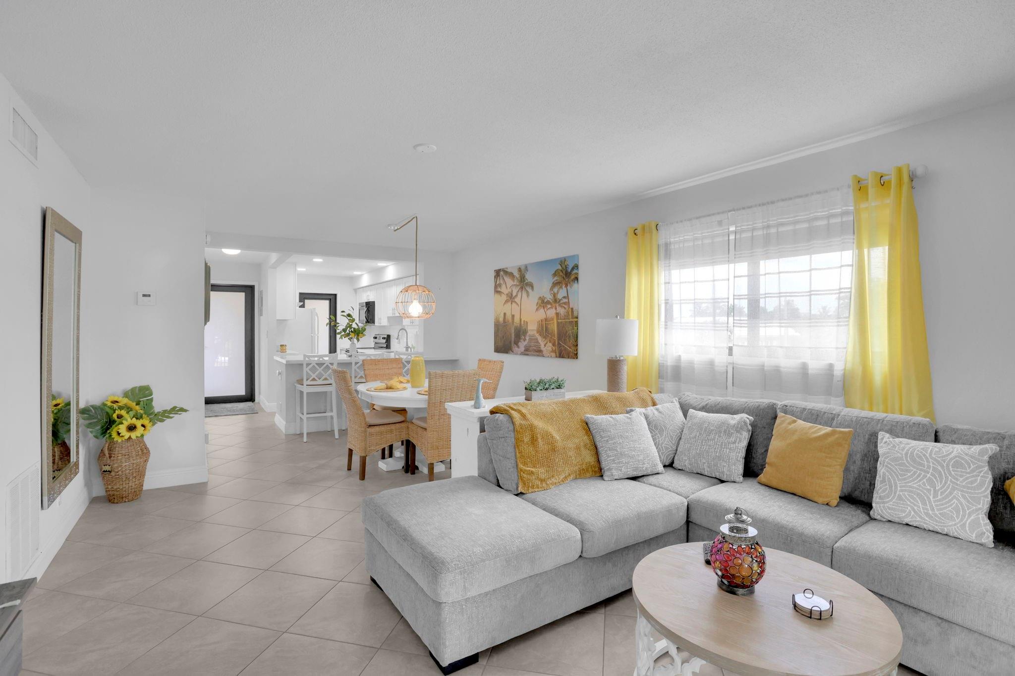 Your Beachside Oasis Awaits. Minutes from sun-drenched beaches, shopping, and dining, this fully updated corner unit condo offers the perfect blend of comfort and coastal charm. Its spacious open floor plan is filled with natural light thanks to extra windows that set it apart from the rest. Inside, you’ll find elegant tile flooring throughout, a modern kitchen with stunning quartz countertops, and tastefully updated bathrooms. Hurricane-impact windows and doors provide peace of mind. Located in a welcoming 55+ community, residents enjoy resort-style amenities including a heated pool, fitness center, clubhouse and more. The building has new roofs and elevators—and no special assessments. This move-in-ready home makes it easy to start living the beachside lifestyle you’ve always wanted.