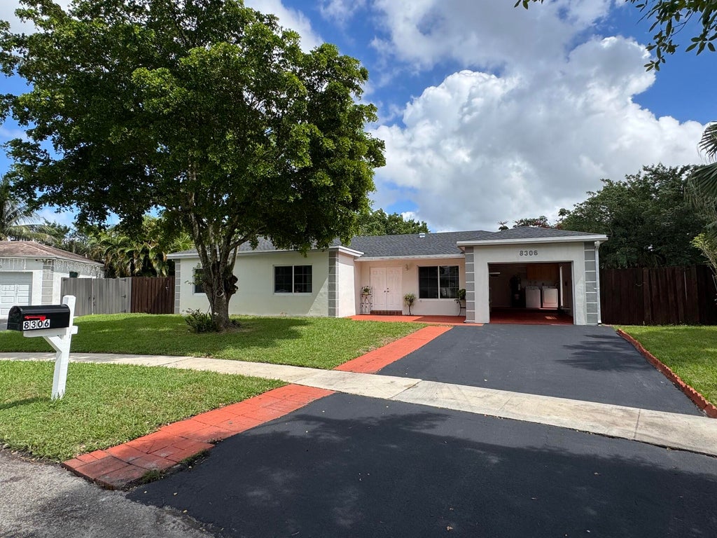 Photo of 8306 NW 74TH Terrace, Tamarac, FL 33321 (MLS # B26081298)