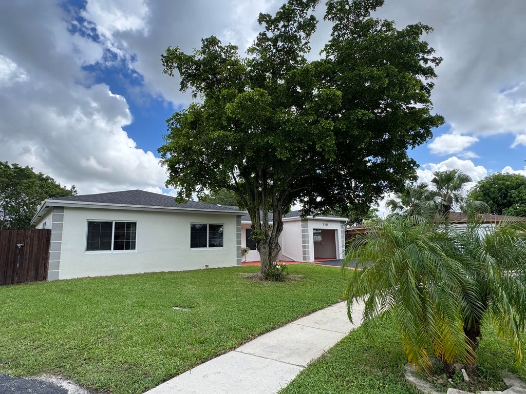 Photo of 8306 NW 74TH Terrace, Tamarac, FL 33321 (MLS # B26081298)