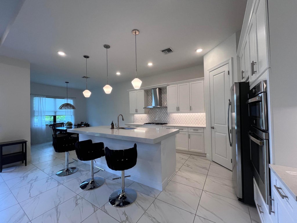 Photo of 5663 Saint Armands Way, The Acreage, FL 33470 (MLS # B26006422)