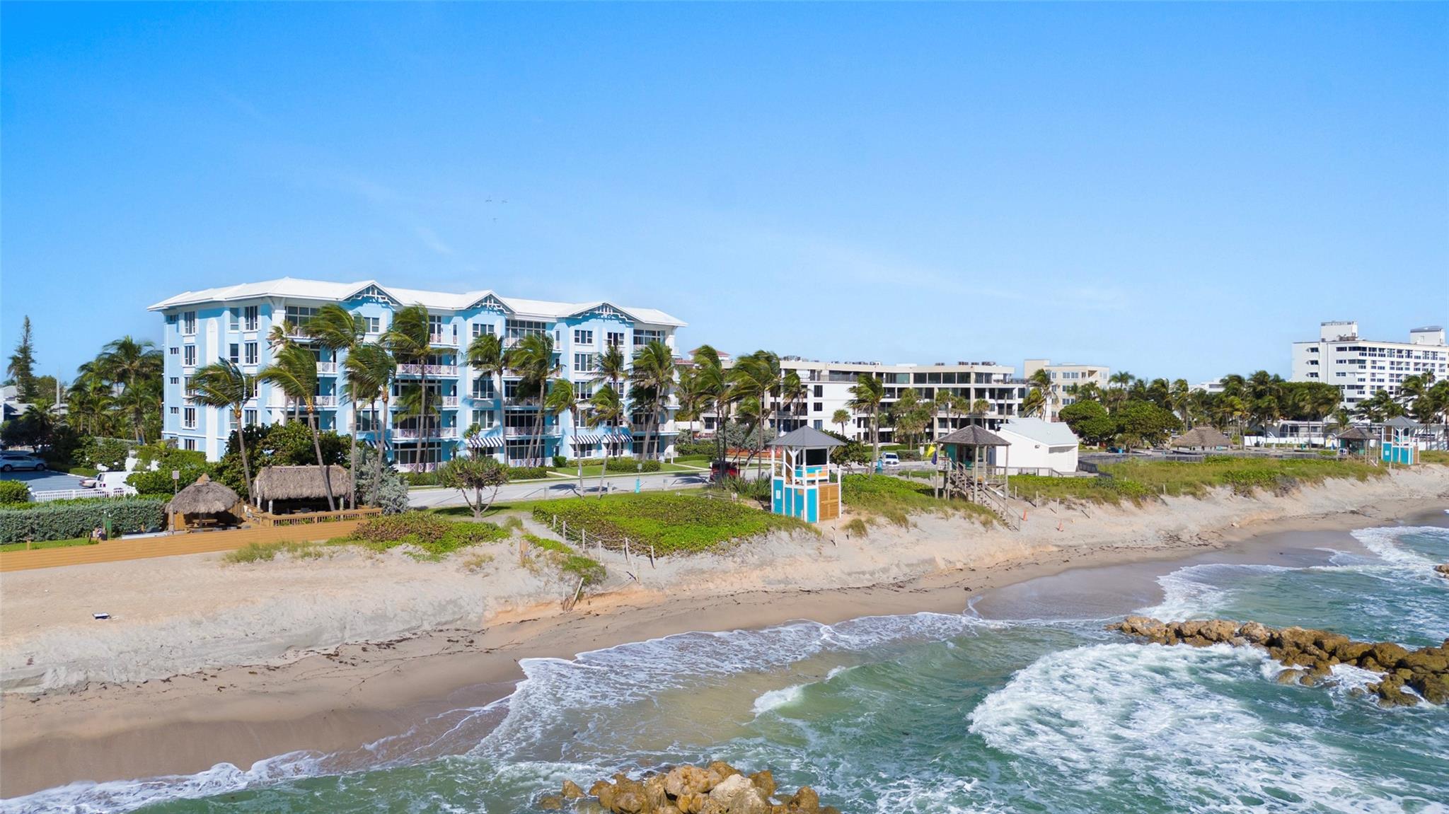 Welcome to residence #109, this 4 bedroom direct oceanfront beach residence offers breathtaking direct ocean views with walls of glass,12 foot high ceilings throughout and a spacious private walk-out patio—just steps from the sand. The living area is bright and inviting, seamlessly blending indoor and outdoor living. The gourmet kitchen is a chef’s dream, featuring Cristallo quartzite countertops, sleek Italian cabinetry, and top-of-the-line Sub-Zero, Bosch, and Thermador appliances. Wake up to the ocean in the primary suite with direct ocean views, complete with a stunning ensuite bath. Two additional ensuite bedrooms each with sliding doors that open to a generous patio with serene pool views. A versatile fourth room offers endless possibilities. This is coastal living at its finest.
