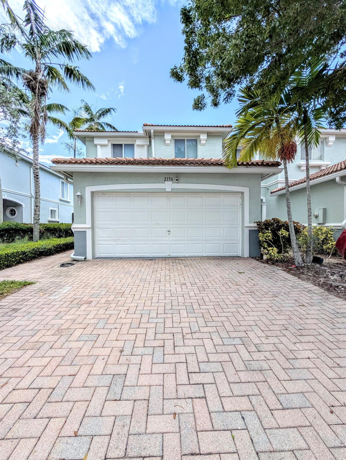 Welcome to 2196 Oakmont Drive, a spacious and beautifully updated 4-bedroom, 2.5-bath townhome nestled in the heart of Riviera Beach. This two-story residence offers over 1,800 sq ft of comfortable living space, perfect for both relaxation and entertaining.Enjoy tranquil water views from your private patio overlooking the peaceful pond--an ideal setting for morning coffee or evening sunsets. Inside, you'll find a thoughtfully upgraded interior featuring stylish finishes, modern lighting, and a bright, open-concept layout. The kitchen features sleek cabinetry, granite countertops, and stainless steel appliances. Upstairs, the generously sized primary suite includes a walk-in closet and en-suite bath with double vanity.