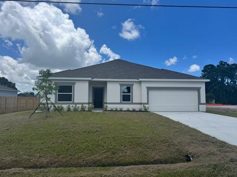 Photo of 3457 SW Ellis St, Port Saint Lucie, FL 34953 (MLS # B26001003)