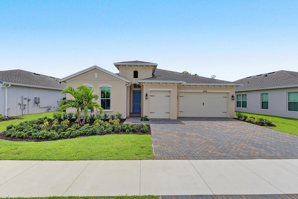 Photo of 10144 NW FIELD FLOWER Trail #153, Port Saint Lucie, FL 34987 (MLS # B26066930)