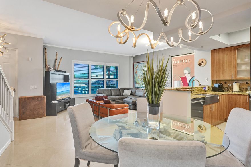 Two bedroom plus office-flex room & two and a half bath town house. Porcelain tile on the first level & newer engineered flooring on second level. Stainless steel appliances with 42" cabinets. Ensuite with dual vessel sinks, Jacuzzi tub, custom closets.  Bedrooms have balconies to watch the sunsets. Beautiful designer lighting. Plantation shutters. Underground parking. Resort style pool. Large clubhouse with fitness center, party rooms, conference room, media room &  warming kitchen. Wilton Station is a 10 acre gated pet friendly community. Two dogs up to 75 lbs each (non-aggressive). Complex just finished installing all new roofs October 2025.  HOA includes fully funding reserves, insurance, internet, cable and all amenities. Complex located close to 'The Drive', Beaches & Highways.