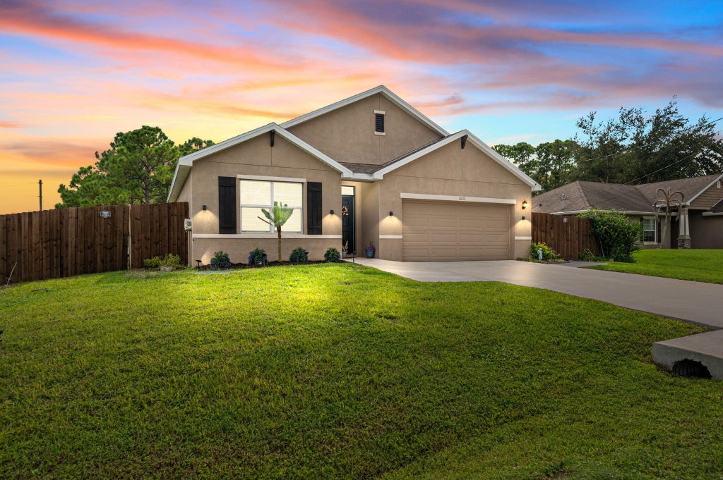 Photo of 1602 SW Lofgren Avenue, Port Saint Lucie, FL 34953 (MLS # B26080188)
