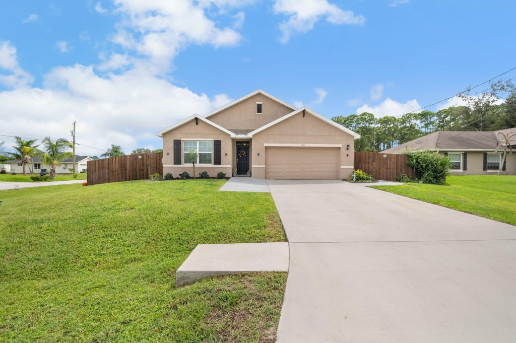 Photo of 1602 SW Lofgren Avenue, Port Saint Lucie, FL 34953 (MLS # B26080188)