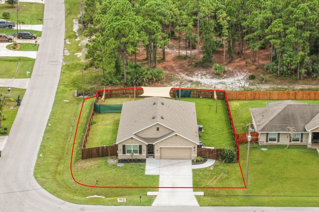 Photo of 1602 SW Lofgren Avenue, Port Saint Lucie, FL 34953 (MLS # B26080188)