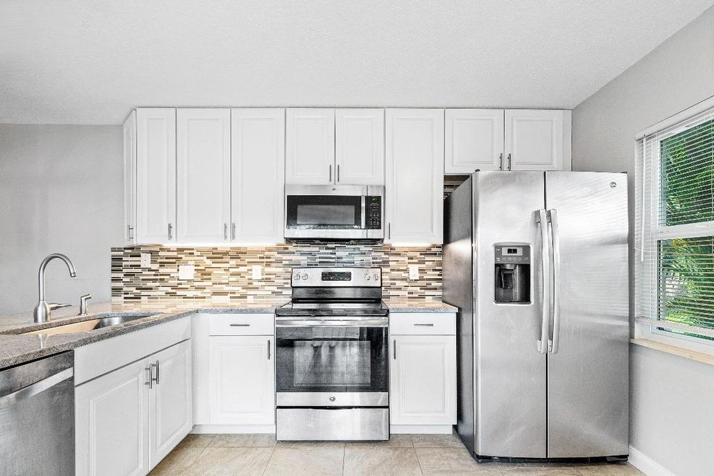 Photo of 43 Essex Court #C, Royal Palm Beach, FL 33411 (MLS # R11127112)