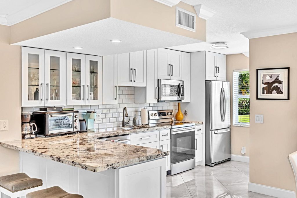 Photo of 35 Colonial Club Drive #104, Boynton Beach, FL 33435 (MLS # R11004243)