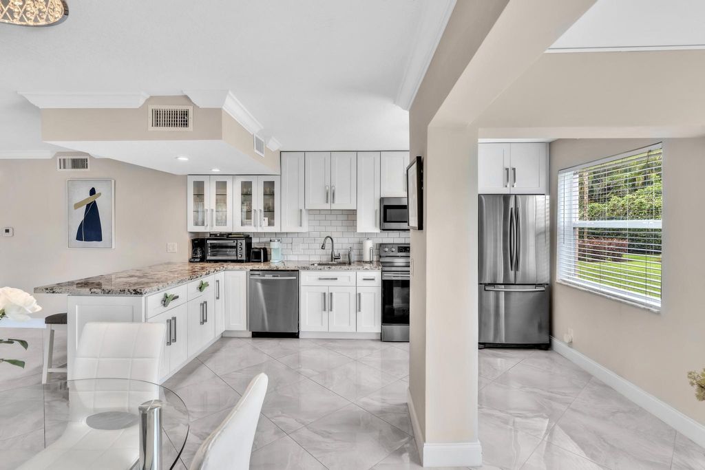 Photo of 35 Colonial Club Drive #104, Boynton Beach, FL 33435 (MLS # R11004243)