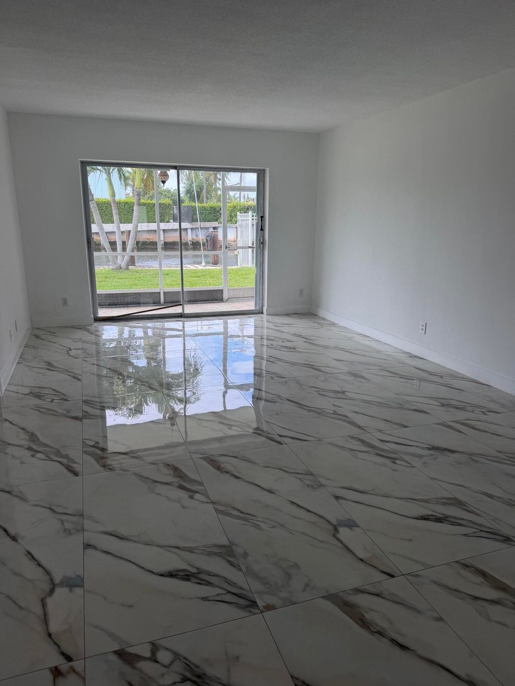 Photo of 1100 Pine Drive #102, Pompano Beach, FL 33060 (MLS # B26016028)