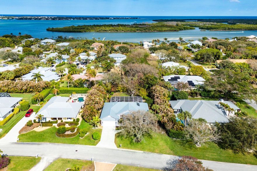 Presenting a four bedroom, three full bathroom plus study pool home in the gated community of The Reef in Rocky Point. Finishes and noteworthy attributes;  kitchen renovation in 2021 with quartz countertops, new appliances including an electric double oven with induction range,  HVAC system installed in 2021, Galvanized standing seam roof installed in 2023, water heater installed in 2025, polyaspartic coated patio/deck with a lifetime warranty installed in 2025, 
engineered wood flooring throughout, new solar shades installed throughout along with new impact front door and new washer and dryer. The Reef offers tennis and pickleball options along with a common kayak launch for intracoastal access.