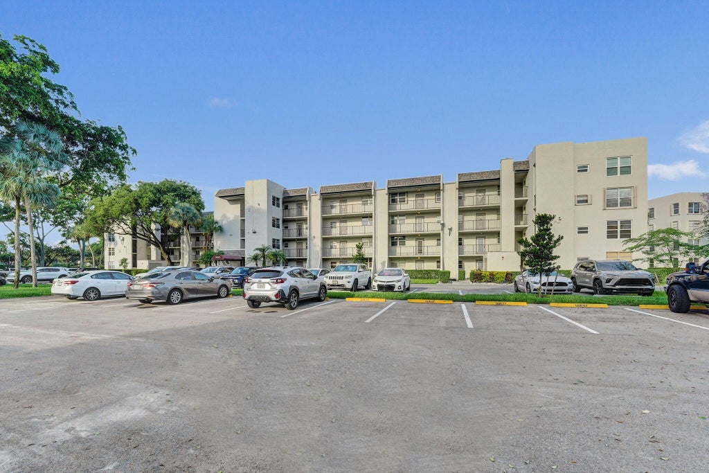 Photo of 9460 Poinciana Place #203, Davie, FL 33324 (MLS # B26079789)