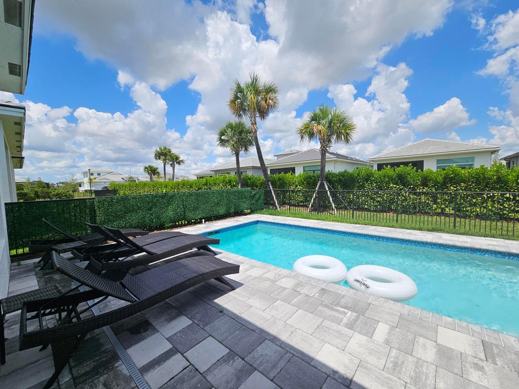 Photo of 9142 SW Esule Way, Port Saint Lucie, FL 34987 (MLS # B26038794)