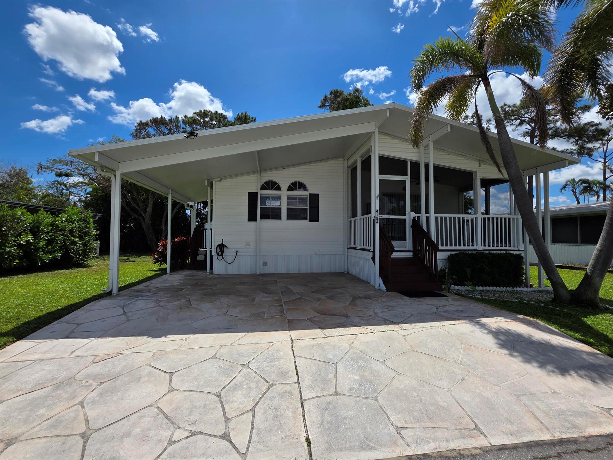 Welcome to your next home in the highly sought-after community of Maralago Cay! This well-maintained 3bed/2bath modular home offers comfort, space & convenience. Built in 2004, this property has been cared for and is move-in ready, coming partially furnished for your added convenience. Enjoy a bright and open floor plan featuring a spacious kitchen, a large primary suite with a private bath, and generously sized guest bedrooms. Step outside to relax on your covered screened patio, perfect for morning coffee or evening gatherings. Maralago Cay is a 55+ community, lot rent of 1319.69 w/ several amenities, pool, gated security, & a prime location close to shopping, dining, and beaches. Don't miss this opportunity to own a charming home in one of the most desirable communities in Lake Worth!