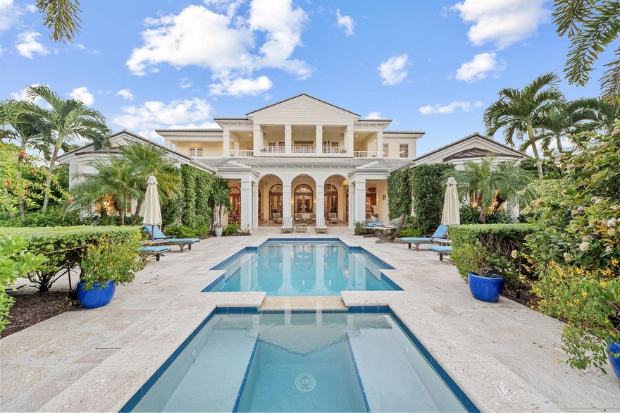 Situated within the exclusive community of Sailfish Point, this exceptional waterfront estate showcases 252 feet of direct water frontage with immediate ocean access. Set on a spacious corner lot, the property offers complete privacy and features a well-equipped dock- perfect for enjoying the South Florida lifestyle.  The living spaces combine comfort and elegance, featuring 4 bedrooms, 5 full bathrooms, and 2 half baths. A custom bar and multiple fireplaces enhance the living room, while the spacious, bright kitchen offers an ideal space for dining and entertaining. Large french doors connect the interior to a generous covered terrace, creating a seamless indoor-outdoor flow.