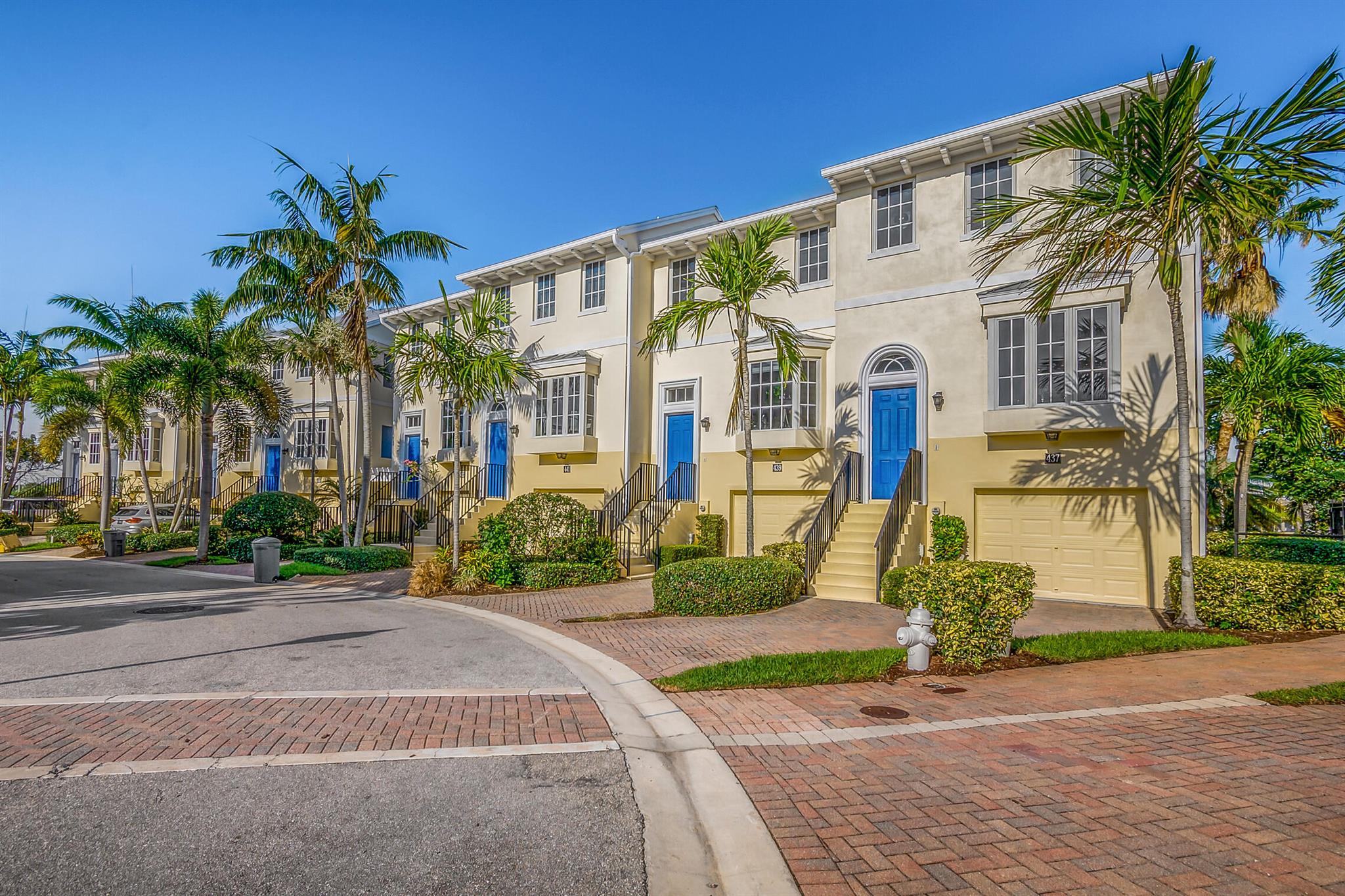 Wake up to refreshing ocean breezes in this impeccably upgraded end-unit townhome, ideally situated in the sought-after beachside enclave of Juno Dunes. This residence offers the perfect blend of style, comfort, and convenience--just moments from the sand.Step inside to find elegant wood flooring throughout, paired with a gourmet kitchen featuring solid wood cabinetry, granite countertops, stainless steel appliances, and sleek automatic window treatments. Hurricane impact glass ensures peace of mind year-round.