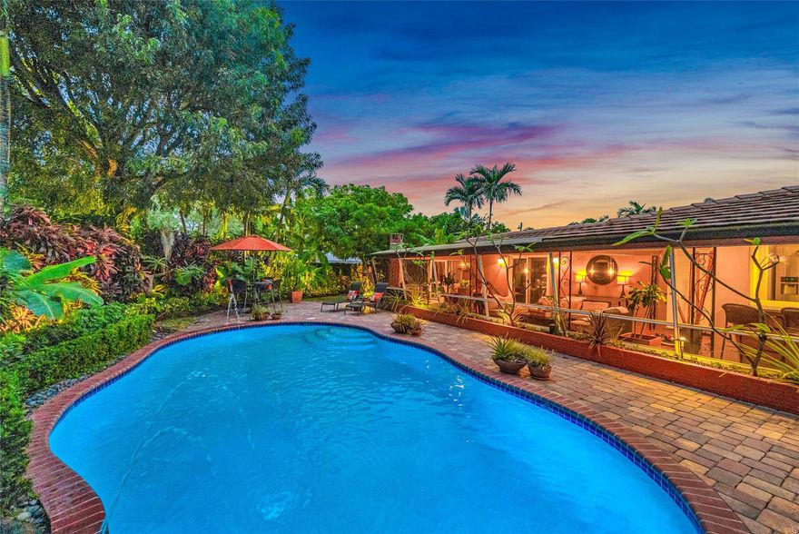 Step inside the gates and escape to your own private mid-century modern oasis, reimagined for 2025 living. Tucked behind a lush ivy-covered 6-ft privacy fence, this 3BR/3BA retreat blends organic design with modern luxury just 2 miles from the famed Lauderdale beaches and Wilton Manors. Inside, restored terrazzo floors, sun-filled windows, and an open layout create a serene flow. The 2BR/2BA main home is complemented by a 1BR guest suite with its own entrance and parking. A saltwater pool, screened terrace, edible gardens, newer tile roof, impact glass, and newer A/C complete this tropical sanctuary of nature, wellness, and luxury. Seller will contribute towards a 3-2-1 Temporary Interest Rate Buy Down for the Buyer. Buyer can benefit from a reduced Interest Rate in the first year.