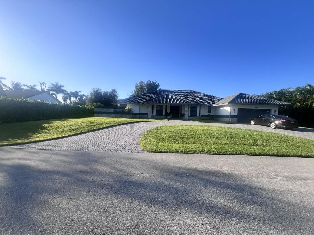 Photo of 11740 Hermitage Dr, Plantation, FL 33325 (MLS # F10532735)