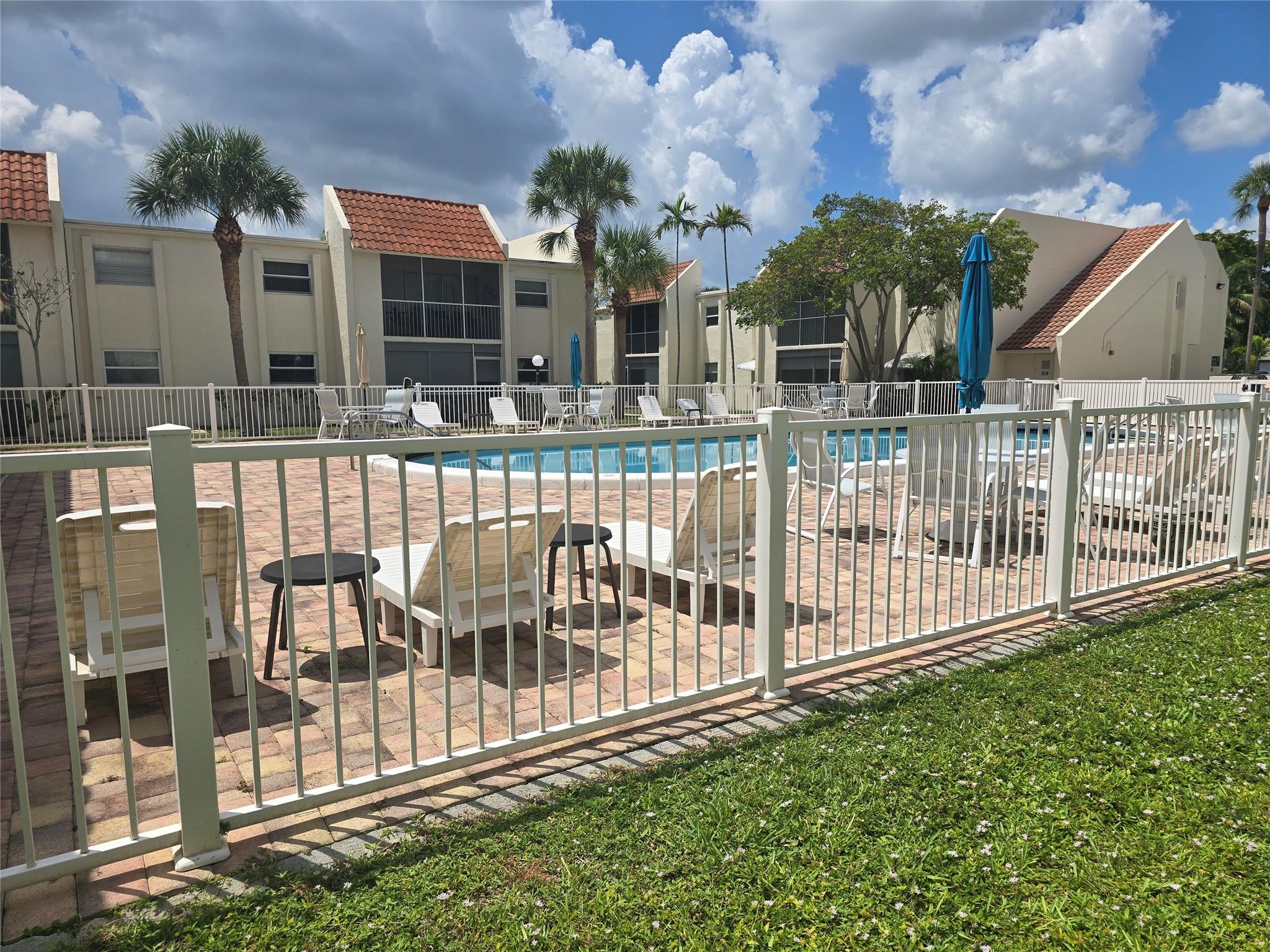 This is truly one of the best units in the complex. Walk out your patio and you are at the pool! Partially remodeled. New AC 2024, Garbage Disposal 2023, Dishwasher 2024, Flooring and Baseboards 2025. Perfect place to live. Close to shopping, restaurants, and beach. Your home awaits!