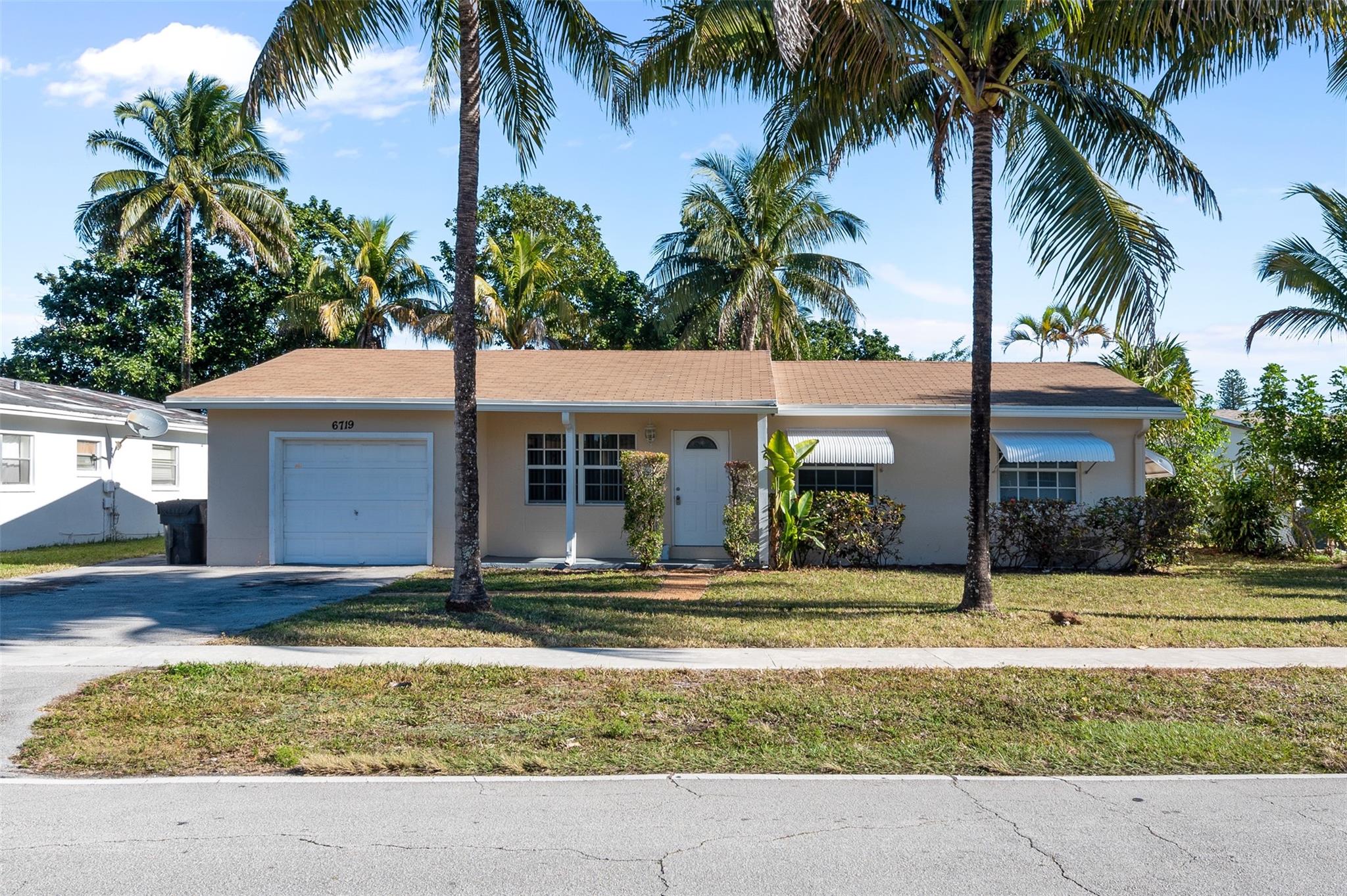 Available for immediate move in, no HOA. Lovely single family home with 3 bedrooms, 2 bathrooms and a 1 car garage. This home features marble styled porcelain tile flooring throughout. Newer kitchen with granite countertop and backsplash with newer refrigerator and microwave. Newer AC. Large, enclosed bonus room. Full size washer/dryer in the utility room. Spacious backyard.