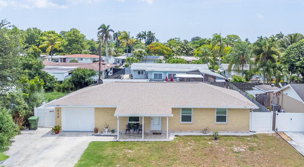 Photo of 220 Davis Road, Palm Springs, FL 33461 (MLS # B26042230)