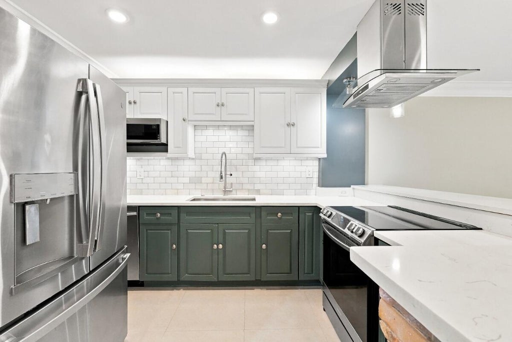 Photo of 3017 N Oakland Forest Drive #102, Oakland Park, FL 33309 (MLS # B26065635)